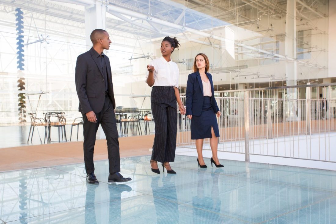Real estate agent showing office building inside